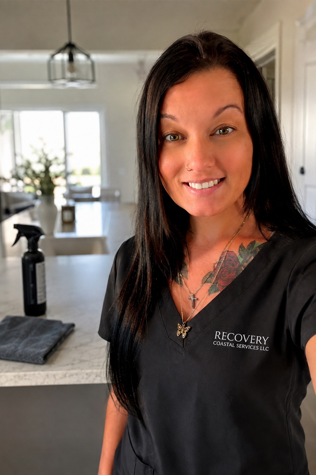Desirae, owner of Recovery Coastal Services, wearing her company uniform